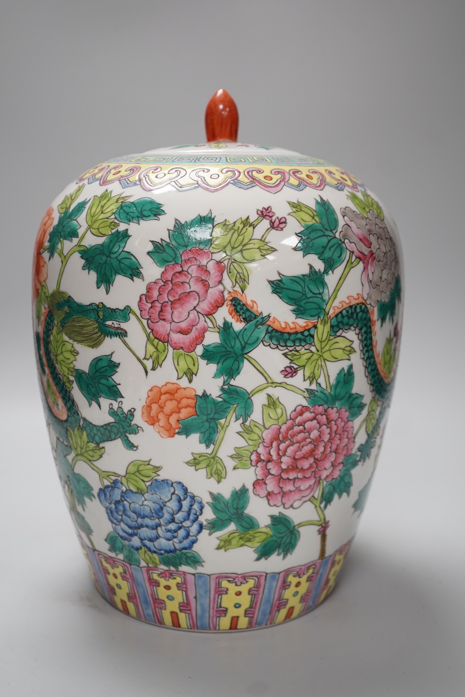 A Chinese famille rose ’dragon’ jar and cover, approximately 30cms high